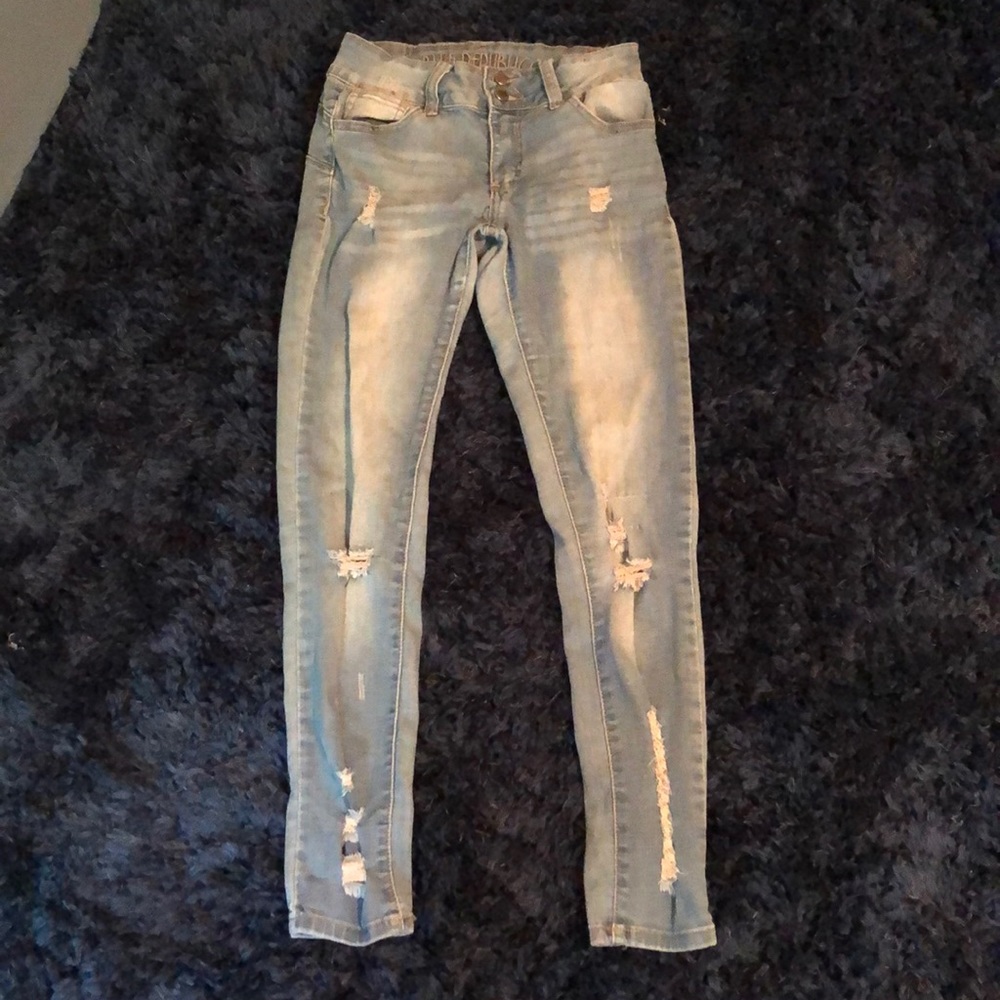 Light blue ripped jeans